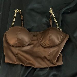 brown silk top with gold chains as straps